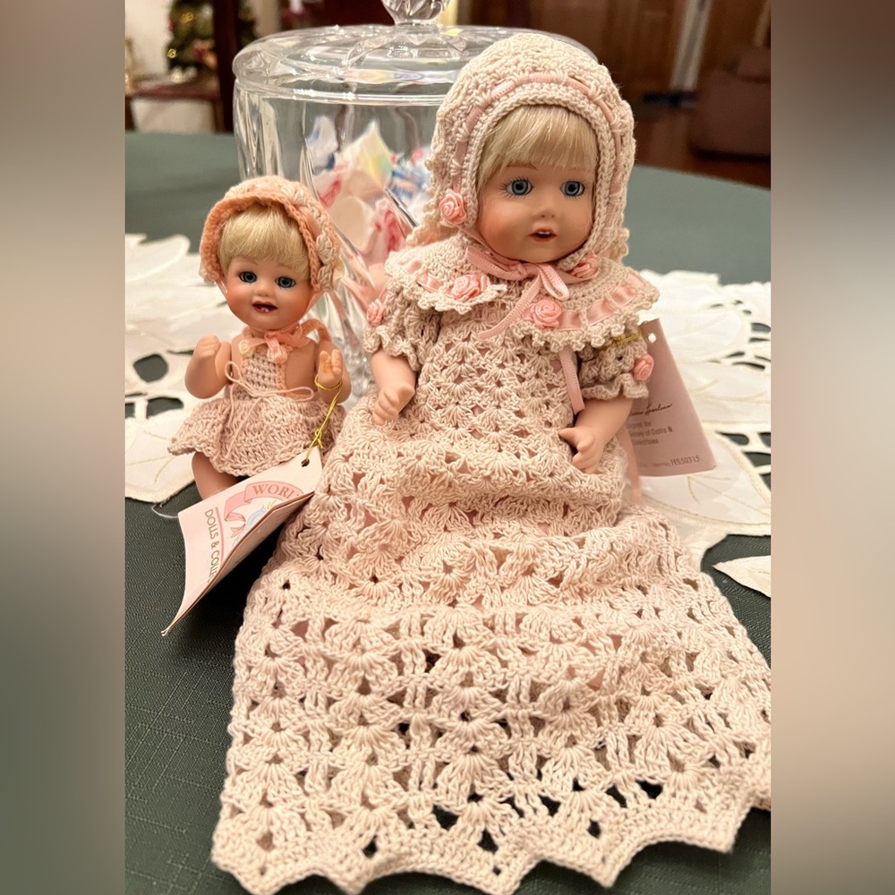 Two World Gallery reproduction vintage jointed dolls in crocheted outfits